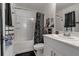 Modern bathroom with white cabinets, shower-tub combination, and decorative accents and towels at 6265 Fairmont Ln, Palmetto, FL 34221