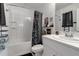 A clean and well-maintained bathroom featuring a tub and shower combination and decorative accents at 6265 Fairmont Ln, Palmetto, FL 34221