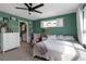 Bedroom featuring green walls, white trim and carpet, along with a ceiling fan at 6265 Fairmont Ln, Palmetto, FL 34221