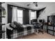 Bedroom featuring black and white decor and a black ceiling fan at 6265 Fairmont Ln, Palmetto, FL 34221
