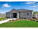 Attractive community center with well-maintained landscaping, green grass, and grey stone accents at 6265 Fairmont Ln, Palmetto, FL 34221