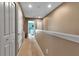 Upstairs hallway featuring neutral paint and carpet with white trim and doors at 6265 Fairmont Ln, Palmetto, FL 34221