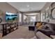 Comfortable living room with a large sectional sofa, a TV, and access to the open-plan kitchen at 6265 Fairmont Ln, Palmetto, FL 34221
