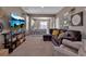 Cozy living area with a soft carpet, a large sofa, and a clear view to the adjacent kitchen space at 6265 Fairmont Ln, Palmetto, FL 34221