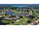 Aerial view of Tara Golf and Country Club featuring a golf course, lakes, residential community, and the clubhouse at 6514 Stone River Rd, Bradenton, FL 34203