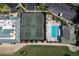 Overhead view of the pool and tennis courts next to the clubhouse, with parking and scenic landscaping at 6514 Stone River Rd, Bradenton, FL 34203