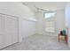 Bedroom with a large closet, a window, tiled floors, and a ceiling fan at 6514 Stone River Rd, Bradenton, FL 34203