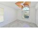 Bright bedroom with unique tray ceiling, fan, large window, and spacious closet at 6514 Stone River Rd, Bradenton, FL 34203