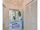 Inviting entryway featuring tiled floors, decorative door wreath, and a screen door at 6514 Stone River Rd, Bradenton, FL 34203