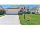 Charming front exterior view with well-maintained lawn and an inviting entryway at 6514 Stone River Rd, Bradenton, FL 34203
