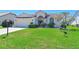 Well-maintained front yard with beautiful landscaping, exterior view, and avian wildlife at 6514 Stone River Rd, Bradenton, FL 34203