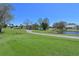 Picturesque view of a golf course with a pond and well-manicured greens at 6514 Stone River Rd, Bradenton, FL 34203
