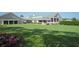 Landscaped golf course with putting green, clubhouse, and golf carts, offering a premium golfing experience at 6514 Stone River Rd, Bradenton, FL 34203