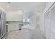 Updated kitchen with stainless steel appliances, granite countertops, and a large center island at 6514 Stone River Rd, Bradenton, FL 34203