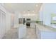Modern kitchen features granite countertops, stainless steel appliances, and ample cabinet space at 6514 Stone River Rd, Bradenton, FL 34203