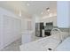 Bright kitchen features stainless steel appliances, white cabinets, and a tiled backsplash at 6514 Stone River Rd, Bradenton, FL 34203