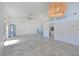 Bright, open living space featuring vaulted ceilings, tile flooring, and a modern ceiling fan at 6514 Stone River Rd, Bradenton, FL 34203