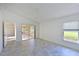 Spacious main bedroom features tiled floors and access to the lanai at 6514 Stone River Rd, Bradenton, FL 34203