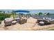 Comfortable outdoor patio with seating, fire pits, and scenic views of the surrounding landscape at 6514 Stone River Rd, Bradenton, FL 34203