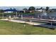 Active bocce ball court next to a tranquil lake with fountain views and comfortable seating for residents to enjoy at 6707 Stone River Rd # 105, Bradenton, FL 34203
