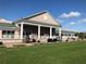 Exterior of the clubhouse featuring lush green lawns and golf cart parking at 6707 Stone River Rd # 105, Bradenton, FL 34203