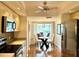 Bright kitchen with stainless steel appliances and a view of the dining area through the breakfast bar at 6707 Stone River Rd # 105, Bradenton, FL 34203