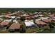 Overhead shot of a tranquil residential area featuring well-kept homes and verdant surroundings at 7118 42Nd E Ct, Sarasota, FL 34243