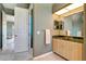 Bathroom with vanity and an open door at 7118 42Nd E Ct, Sarasota, FL 34243