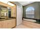 Bathroom with soaking tub and granite countertop at 7118 42Nd E Ct, Sarasota, FL 34243