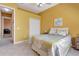 Cozy bedroom with a decorative bedspread, closet, and view into another room at 7118 42Nd E Ct, Sarasota, FL 34243