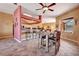 Spacious dining room adjacent to the kitchen features modern light fixtures and stylish furnishings at 7118 42Nd E Ct, Sarasota, FL 34243