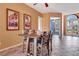 Dining room with a dark wood table, tiled floors and plenty of natural light at 7118 42Nd E Ct, Sarasota, FL 34243