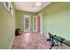 Large, bright flex room with double French doors leading to the backyard, perfect for a home gym or recreation room at 7118 42Nd E Ct, Sarasota, FL 34243