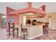 Large kitchen featuring breakfast bar, ample counter space, stainless appliances, and modern design at 7118 42Nd E Ct, Sarasota, FL 34243