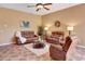 Comfortable living room featuring tiled floors, ceiling fan and neutral paint at 7118 42Nd E Ct, Sarasota, FL 34243