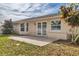 Backyard patio with lots of light, green grass and mature landscaping at 7211 Antigua Pl, Sarasota, FL 34231