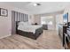 Serene bedroom with hardwood floors, natural lighting, and light gray walls at 7211 Antigua Pl, Sarasota, FL 34231