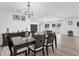 Elegant dining room showcasing wood flooring, dark wood furniture, and stylish decor at 7211 Antigua Pl, Sarasota, FL 34231