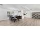 Formal dining room with a large table, elegant chandelier, and abundant natural light at 7211 Antigua Pl, Sarasota, FL 34231