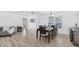 Dining room features wood floors, neutral paint, and an elegant wooden dining table at 7211 Antigua Pl, Sarasota, FL 34231