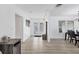Bright entryway with wood-look flooring, double doors and view of dining area at 7211 Antigua Pl, Sarasota, FL 34231
