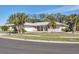Beautiful single-story home with a well-manicured lawn and mature landscaping at 7211 Antigua Pl, Sarasota, FL 34231