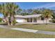 Charming single-story home featuring a manicured lawn and a welcoming entrance at 7211 Antigua Pl, Sarasota, FL 34231