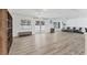 Bright living room with wood floors, natural light, and comfortable seating arrangement at 7211 Antigua Pl, Sarasota, FL 34231