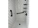 Bright white shower with black fixtures and subway tile walls is a modern oasis at 7211 Antigua Pl, Sarasota, FL 34231