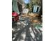 Backyard deck with a grill and decorative stone landscaping with a view of a storage shed and partial fence at 728 41St St St, Sarasota, FL 34234