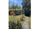 Charming single-story home with lush landscaping and a stone walkway, creating a welcoming curb appeal at 728 41St St St, Sarasota, FL 34234