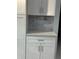 Close up of the kitchen cabinets with a stone backsplash and stone countertop at 728 41St St St, Sarasota, FL 34234