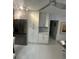Bright kitchen features white cabinets, stainless steel appliances, and modern lighting at 728 41St St St, Sarasota, FL 34234