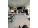 Spacious living room boasts tile floors, comfortable seating, and dual mounted TVs at 728 41St St St, Sarasota, FL 34234